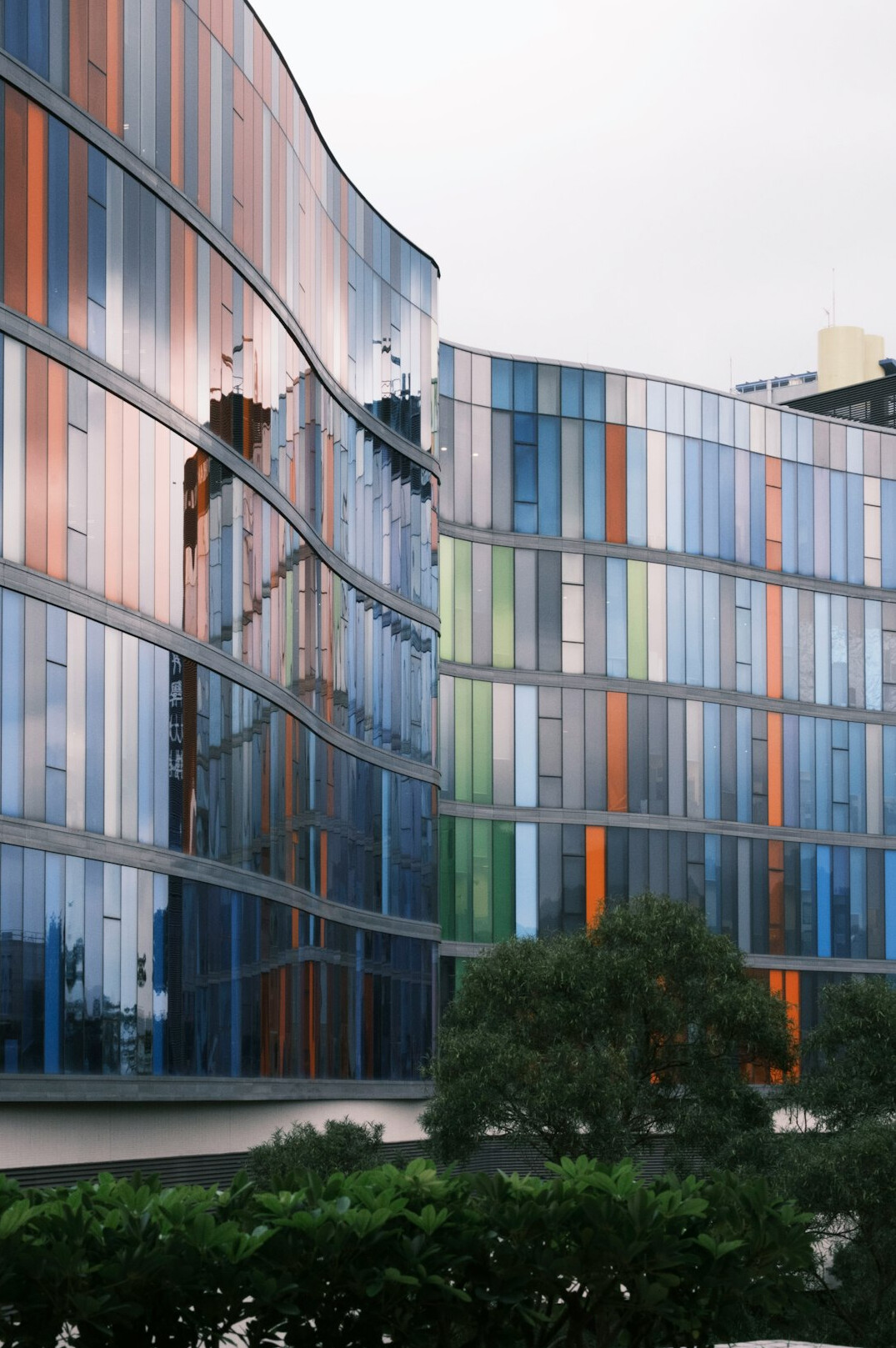 Modern hospital building exterior with glass facade