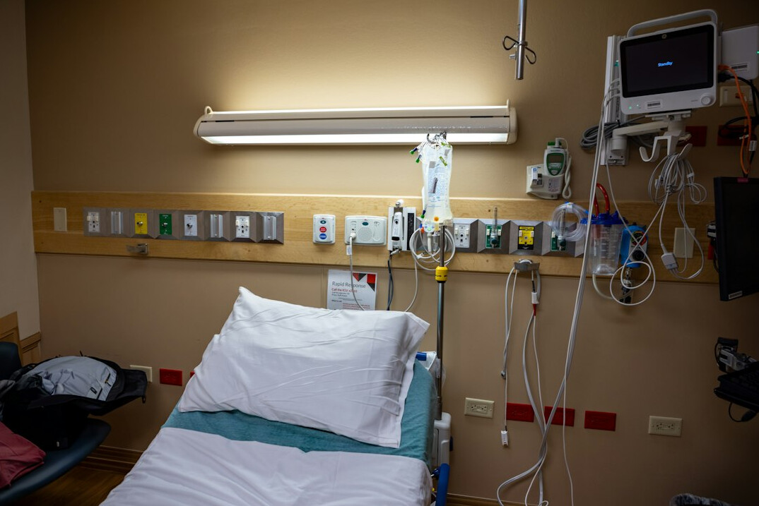 person recovering in hospital bed