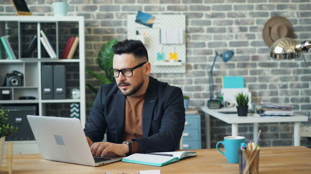 person planning future on laptop