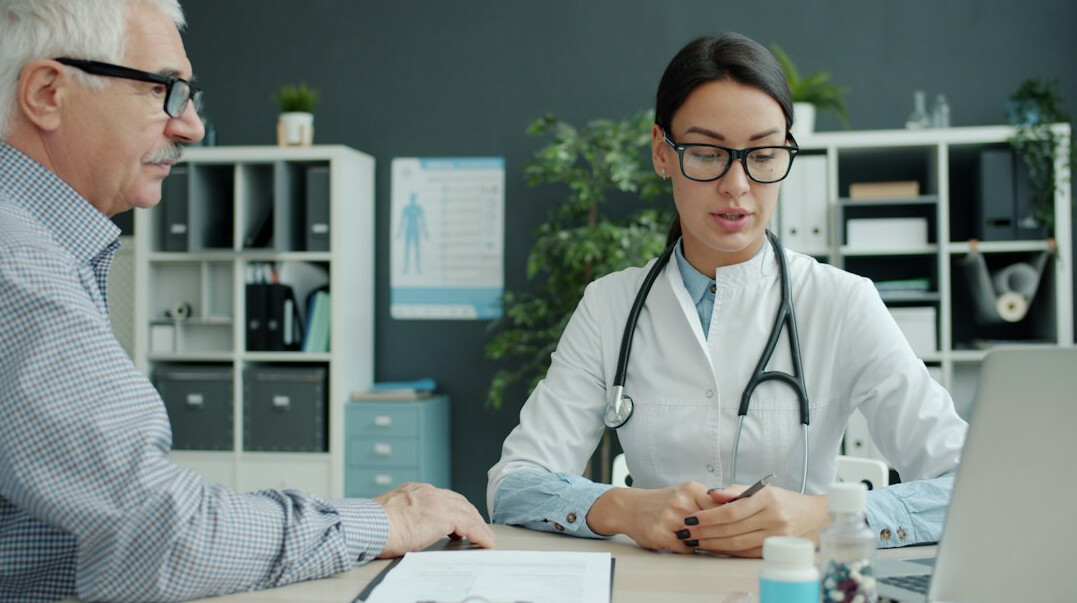 doctor examining patient