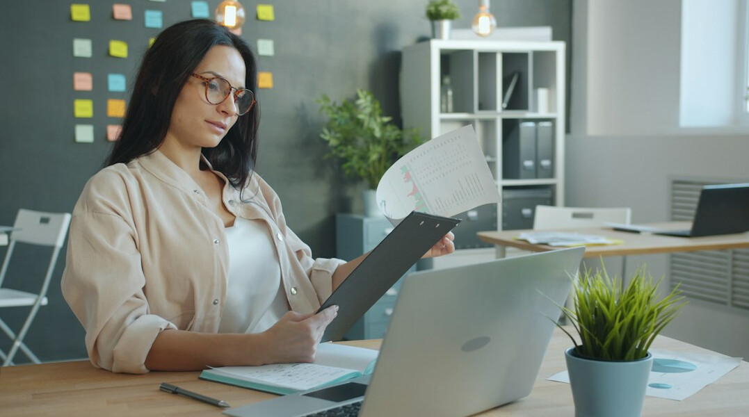 young adult reviewing insurance papers